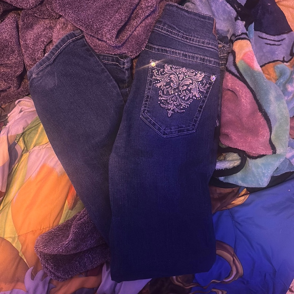 Jeans!! They are stretchy dark wash with cute little gems on the butt